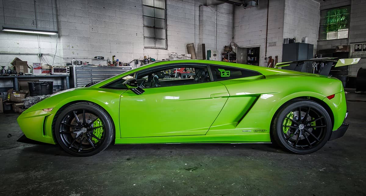 Green Lamborghini Gallardo in a garage 