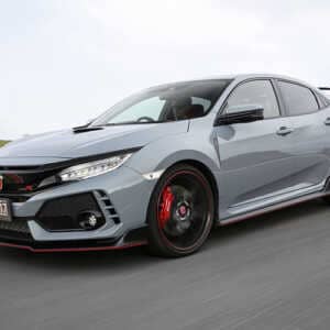 Grey 2018 Honda civic type r speeding down a road, front view. The car has a Syvecs Honda Civic Type R FK8 - S7PLUS ECU fitted