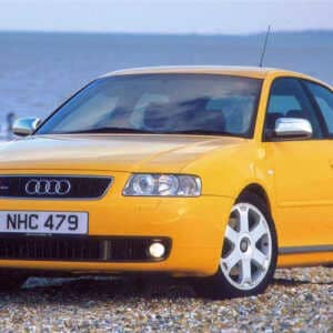 Yellow Audi S3 parked near the sea. The car is running the awsome Syvecs Audi S3 S7PLUS ECU