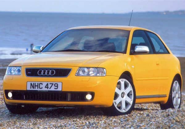 Yellow Audi S3 parked near the sea. The car is running the awsome Syvecs Audi S3 S7PLUS ECU