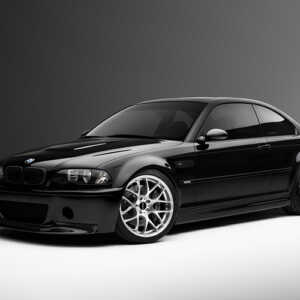 Black BMW e46 M3 side shot beautiful lighting in a grey studio. Running the awesome Syvecs BMW E46 M3 S7PLUS ECU