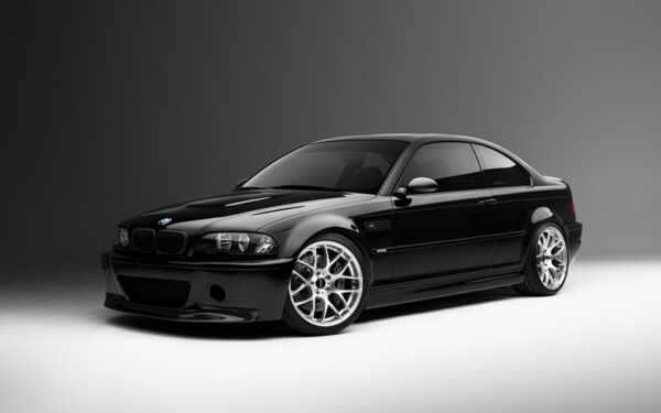 Black BMW e46 M3 side shot beautiful lighting in a grey studio. Running the awesome Syvecs BMW E46 M3 S7PLUS ECU