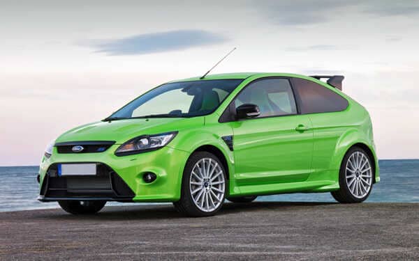 Green Ford Focus RS by the beach. Fitted with Syvecs Ford Focus RS ST MK2 - S7PLUS ECU kit