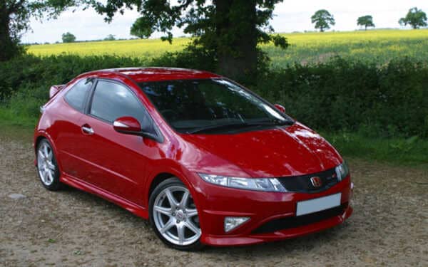 Red Honda type r parked in a field front view. Fitted with Syvecs Honda Type R ECU