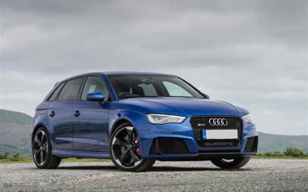Bark blue Audi RS3 MK2 with black wheels parked on gravel with a moody sky. Has the Awesome Syvecs Audi TTRS-RS3 MK2 8P S7PLUS ECU, the Plug N Play kit.