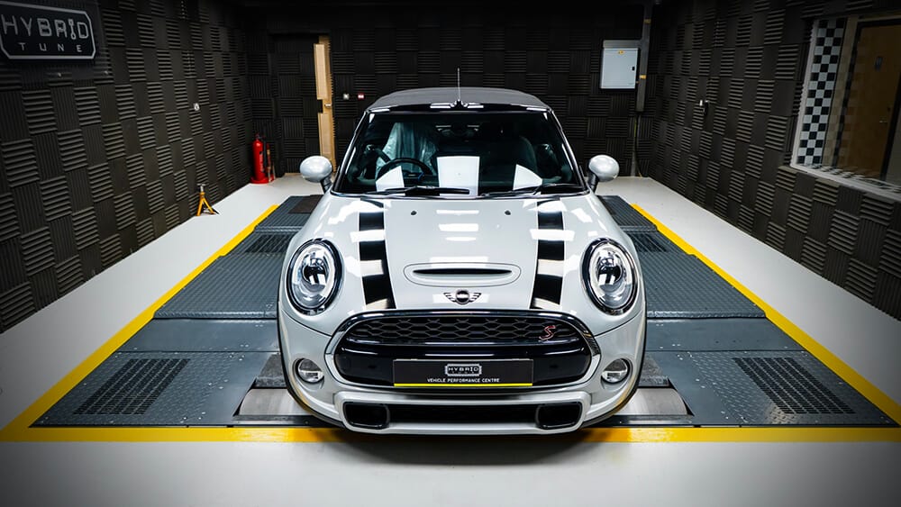 https://i.hybridtune.co.uk/wp-content/uploads/2023/02/Front-dhot-of-grey-Mini-cooper-S-in-Hybrid-Tunre-Dyno-cell-havin-a-Mini-F56-Cooper-S-JCW-Tuning-B48-upgrade-installed.jpg