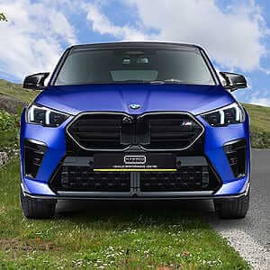An exclusive, tailor-made offering for BMW F39 X2 M35i tuning. Front shot of a metallic blue BMW suv parked on a grass verge at the side of the road