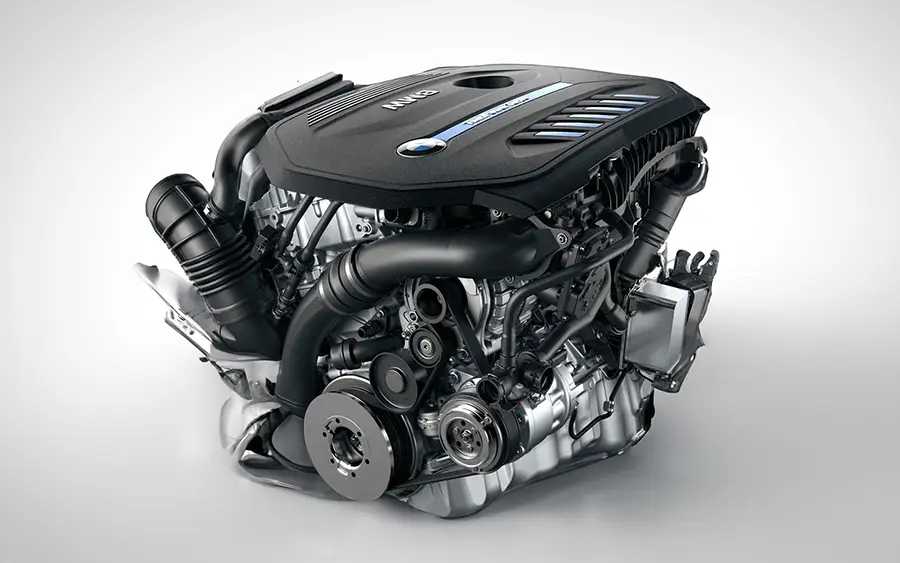 BMW M440i G22 Tuning Box B58TU Strat-2 3 We guarantee real-world performance gains for the B58TU engine. Picture of the engine with a black cover against a white background